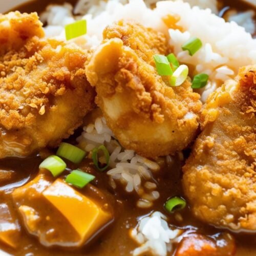 Crispy Chicken Katsu sliced over steamed rice with curry sauce